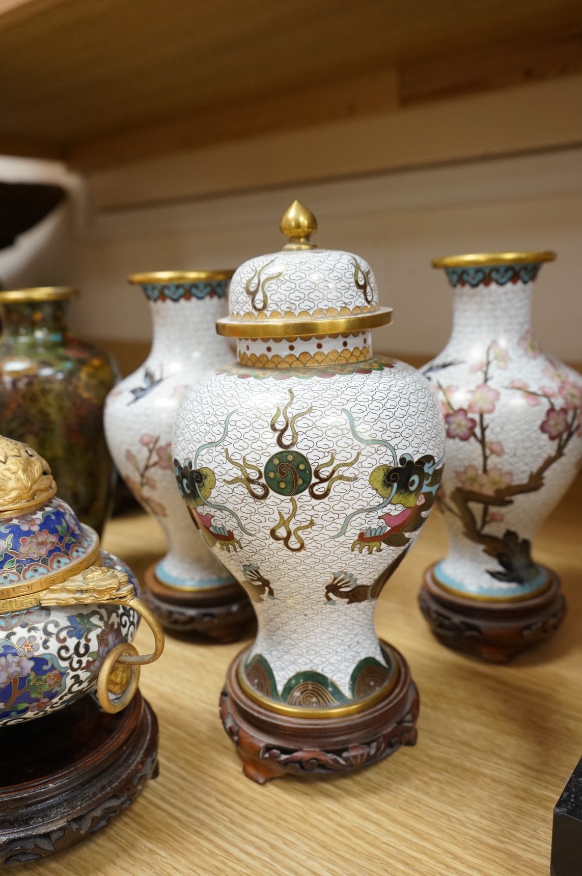 A plique a jour enamel tea bowl together with a collection of cloisonné enamel vases, bowls etc., tallest 26cm
